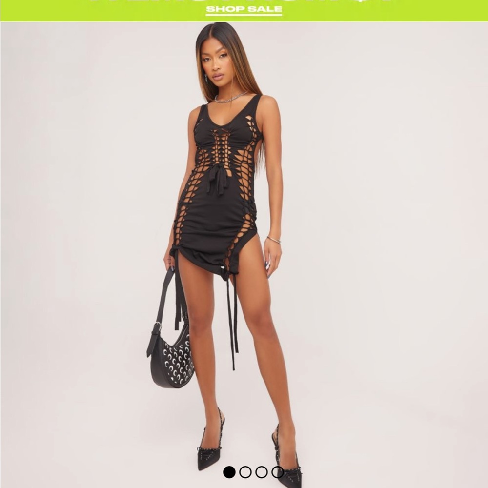 Never worn. Low scoop neck extreme lace up detail.